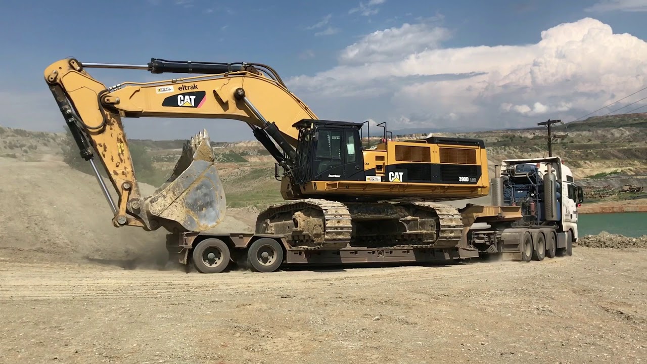 Loading And Transporting By Side The 100 Tones Caterpillar 390D ...