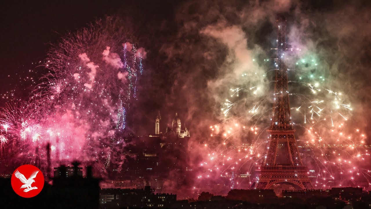 Watch the Eiffel Tower light up with fireworks for Bastille Day