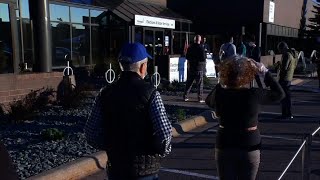People line up in Minnesota as early voting begins