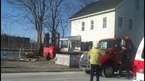 Choking driver slams lumber truck into Lowell home