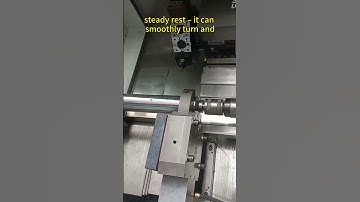 CNC mill-turn machine with a powered turret and hydraulic steady rest