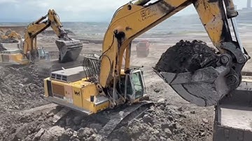 Two Liebherr 974 Excavators Loading Overburden On A Fleet Of Trucks At Busy Mining Site - Ascon Ltd