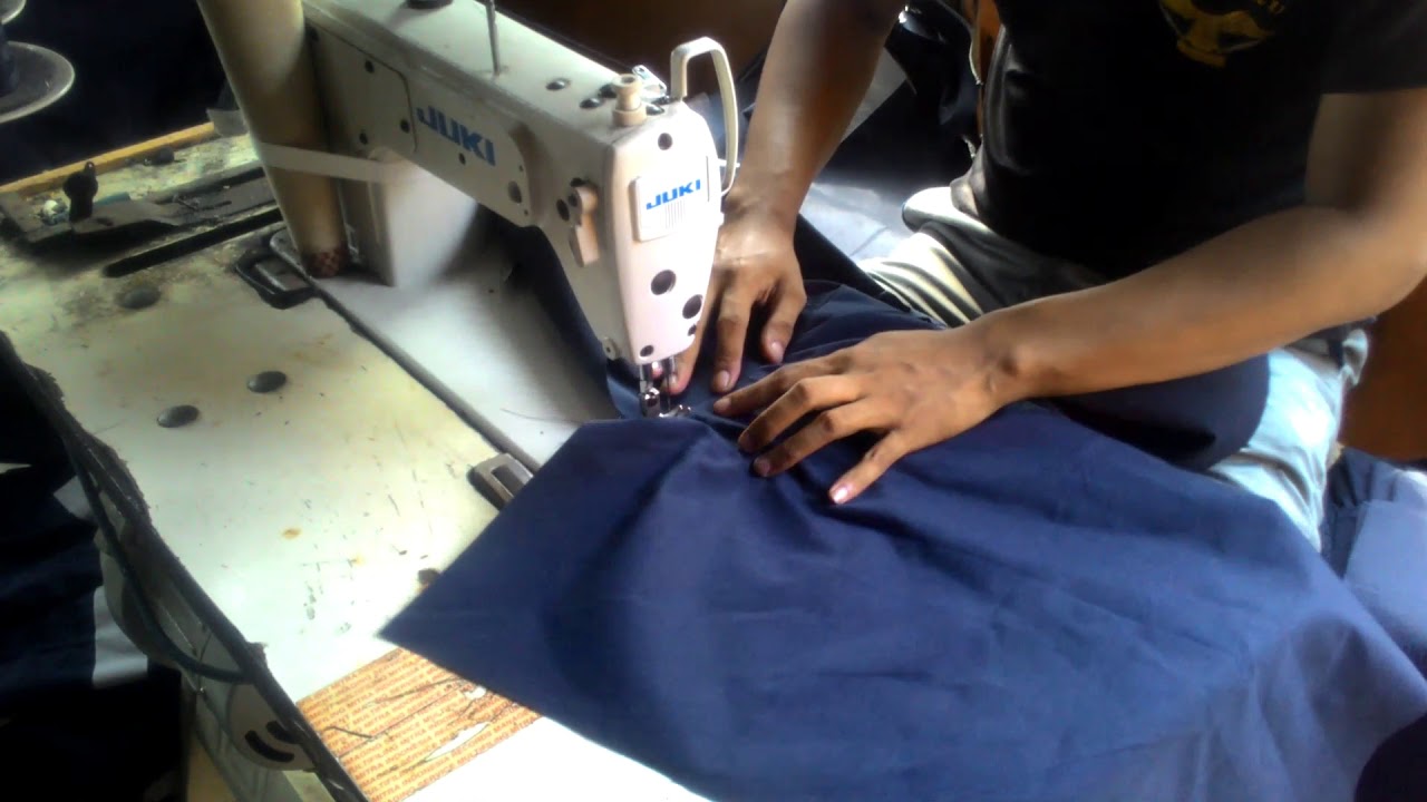 Proses pemasangan resleting wearpack