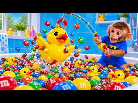 BONBON the little monkey has fun fishing for colorful candies with a giant yellow duck 🍬🦆
