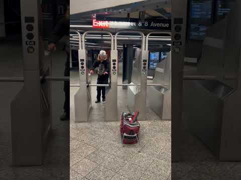 Man fails to clear subway turnstile and falls in New York City, New York, USA