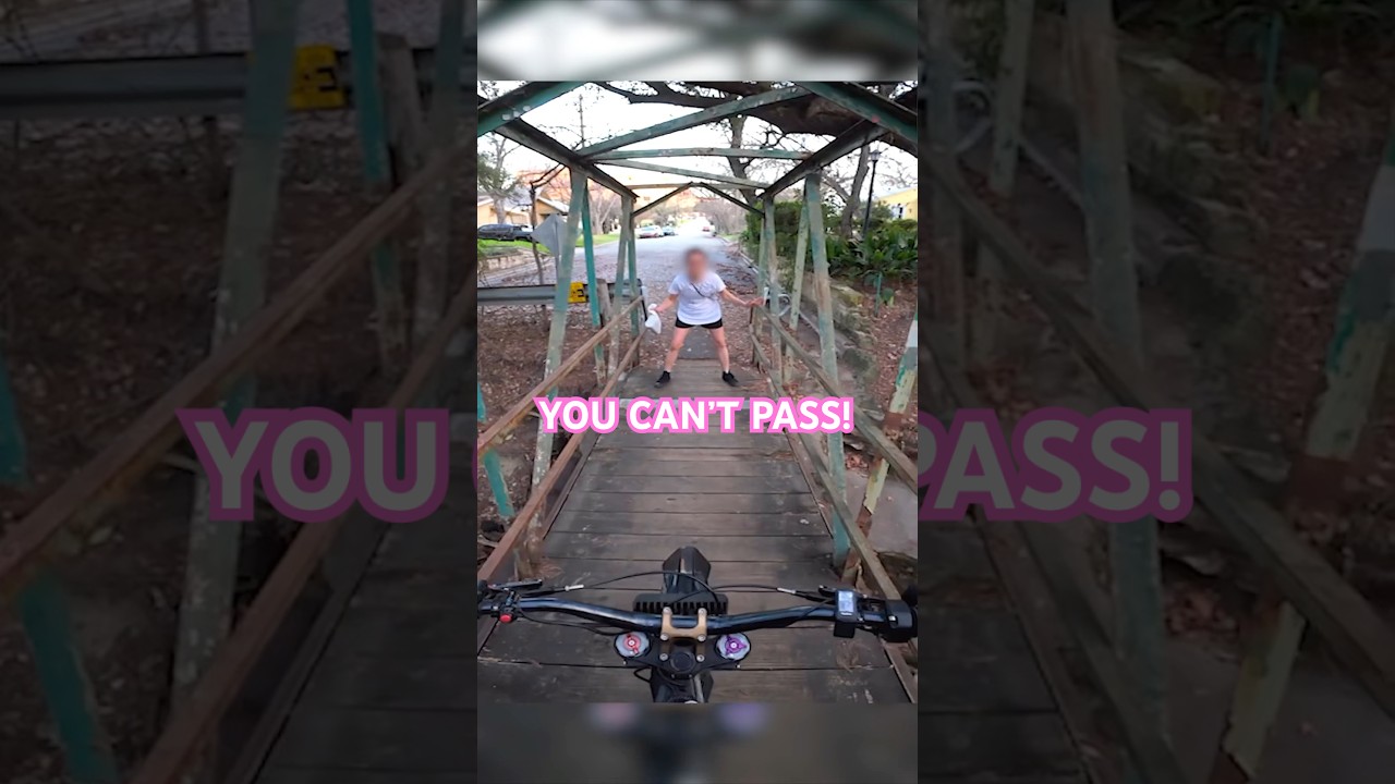 Lady tries to stop biker so he takes her groceries 😂 