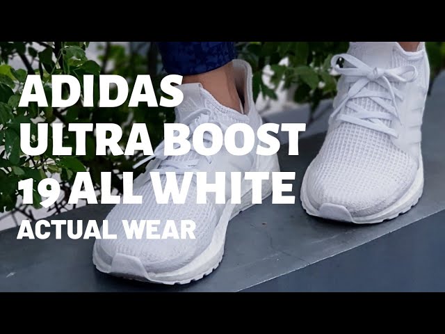 white ultra boost on feet