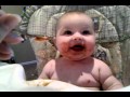 Cute baby eating Gerber prunes