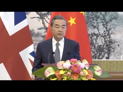 Chinese Foreign Minister: Threat, Pressure Counterproductive to Solving Trade Disputes newspaper mockup