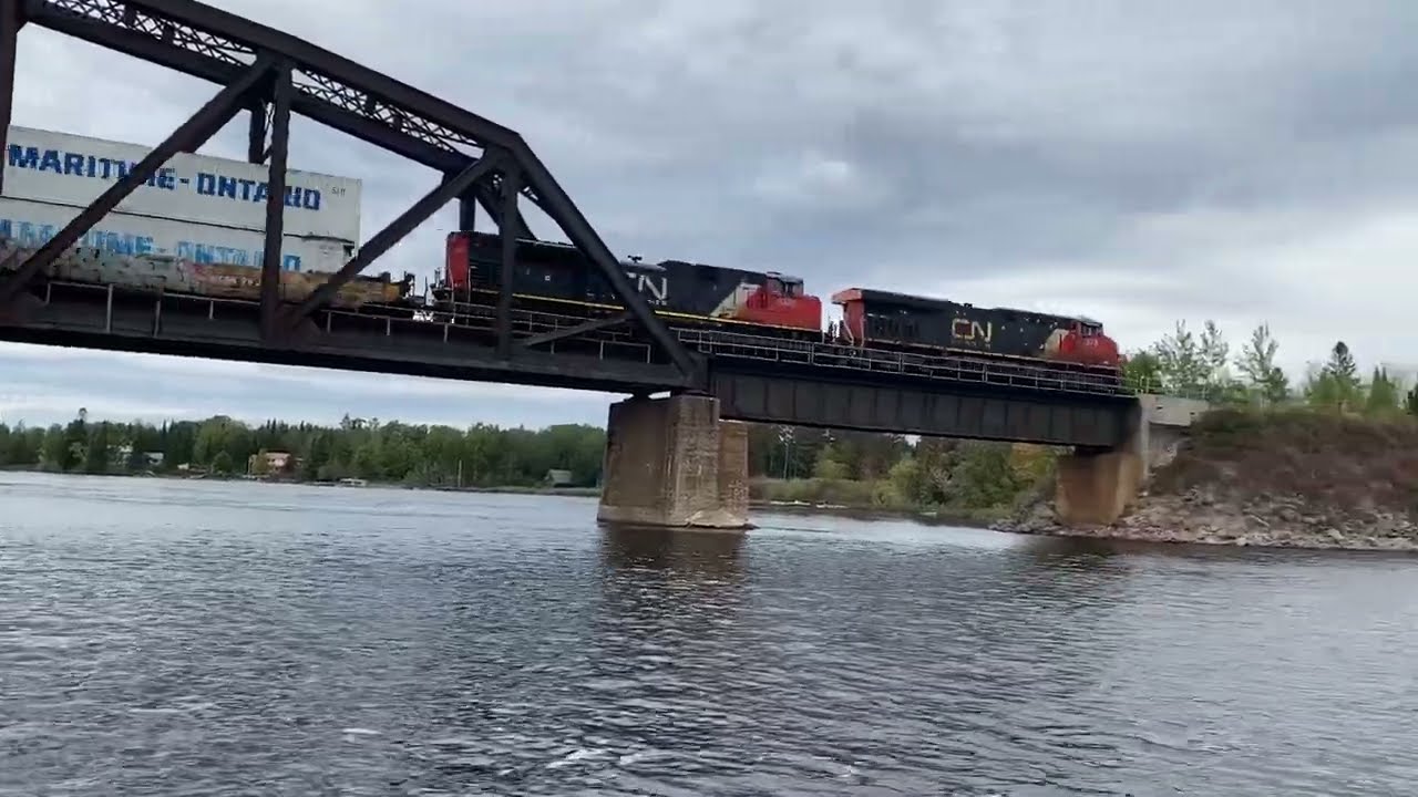 CN intermodal train going over awesome old bridge in Minaki Canada
