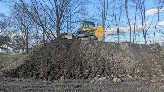 Moving A Dirt Pile With A New Holland 327 Skidsteer Ep. 1