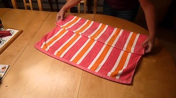 How to fold a beach towel into a cute bolster pillow with a pocket