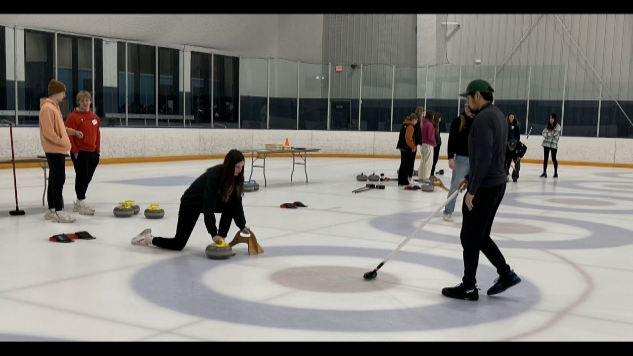 Students at Clear Creek Amana learning about physics through curling