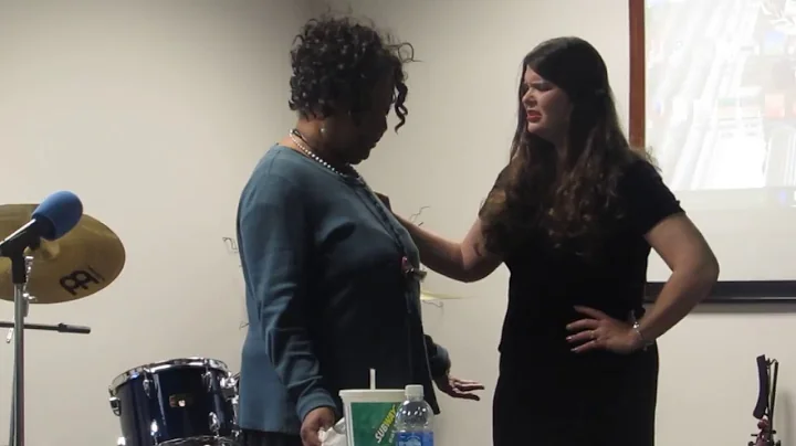 Susan prophesying over Stephanie at Triumphant Bib...