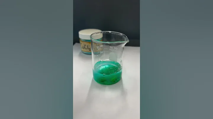 Adding copper (II) chloride crystals to water
