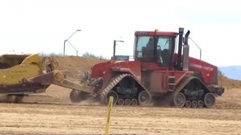 Mean Sounding Case IH Quadtrac Singing with Dual Towed Scrapers