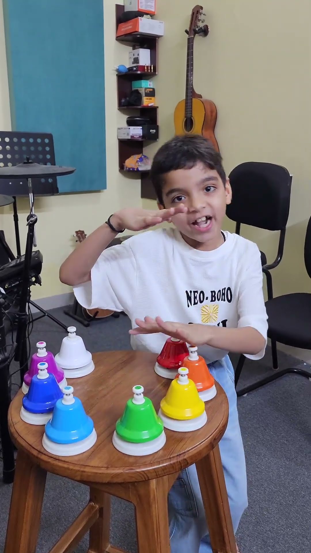Ansh playing the Colour Song on colourful desk bells