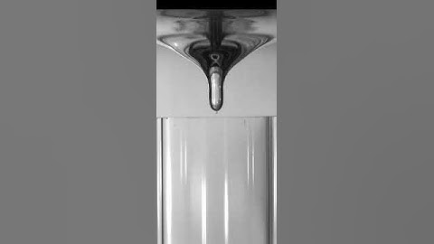 Slow motion video of Bathtub vortex - dip formation