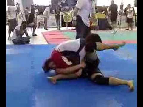 man wrestling defeats Woman