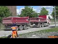 4k dump trucks leaves the construction site after being loaded with material