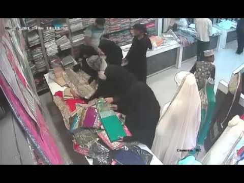 Lady thief caught stealing from textile shop. Caught on CCTV . Cheating ...