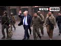 Volodymyr Zelensky and Boris Johnson walk through the streets of Kyiv