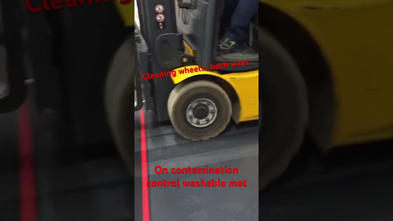 Cleaning forklift’s wheels on washable contamination control. 