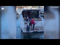 Drunk woman stumbles from docked boat into water in hilarious footage