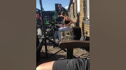 Holly Beal playing drums