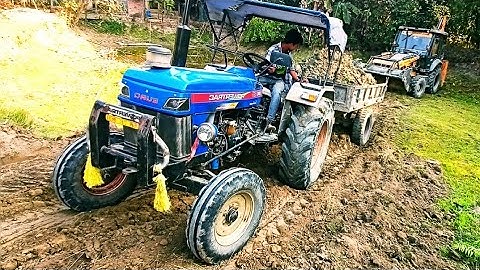 Jcb 3dx Backhoe Loader Machine loading mud in Sonalika Di 52 rxr Powertrack 47