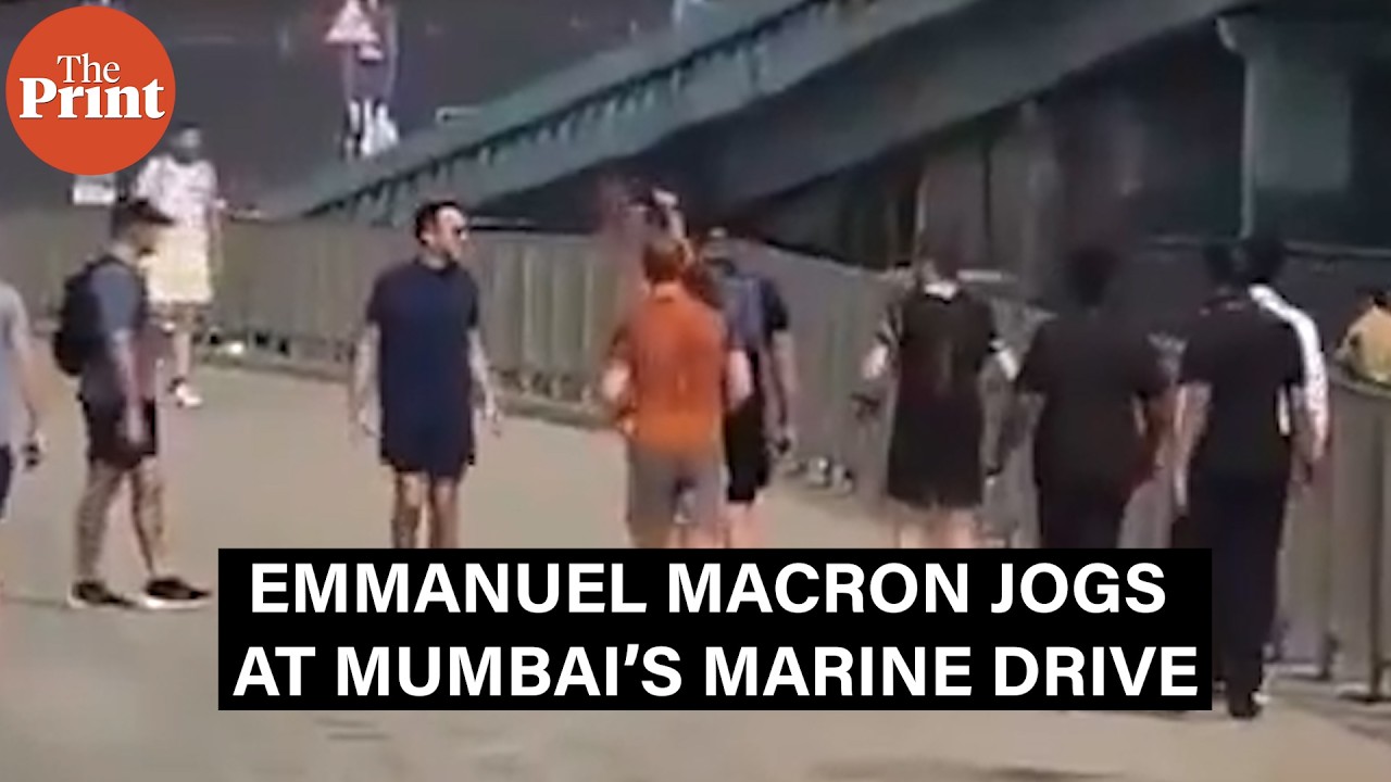French President Emmanuel Macron jogs at Mumbai's Marine Drive.