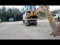 Backhoe loader lovol unloading from dump truck  roland repair vlog