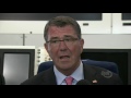 Secretary of Defense Ash Carter speaks with reporters on board his aircraft en route from Tu...