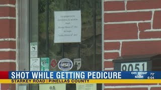 Detectives investigate accidental shooting at gun store that injured woman in neighboring salon