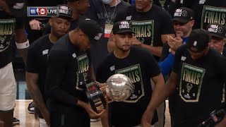 Bucks celebrate with the NBA eastern conference finals trophy after game 6 vs Hawks