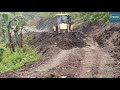 Hilly Road Leveling and Removing Dirt after Excavator-Backhoe Loader