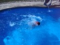 Funny kid does a slopish bellyflop