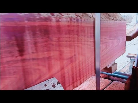 beautiful shape of red wood sawed in a wood sawmill for boards and ribs