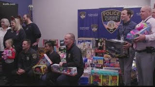Family collects more than 700 toys for police to give to kids in need
