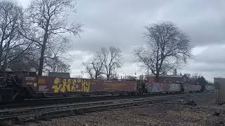 BNSF 8548 leads a long Baretable train through Coal City, IL