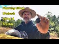 Using a tractor to plant walnuts