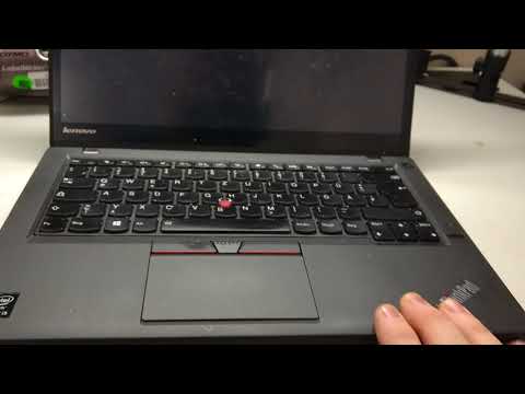 Where is the reset button on a Lenovo computer?