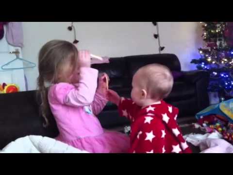 Olivia not giving her sister any cheese string :)