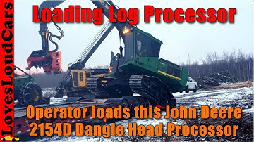 Loading a John Deere 2154D log harvester on a lowboy
