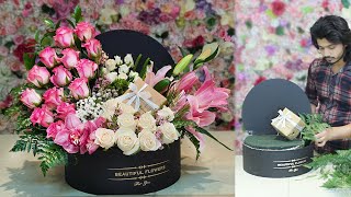 Flower bouquet with gift in a box, beautiful gift presentation