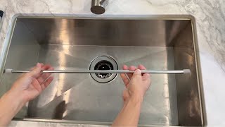 Stick A Tension Rod In Your Kitchen Sink... This Is Brilliant