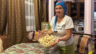 Grandma cooks dinner high in the mountains of Ukraine