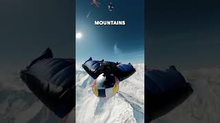 Wingsuit Fly By Skis With Perfect Timing On Slopes