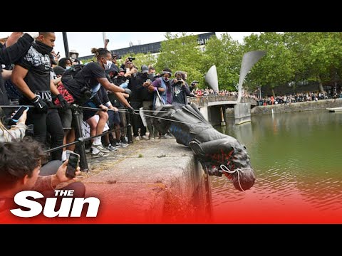 BLM protesters pull down statue of Edward Colston before throwing it into river in Bristol