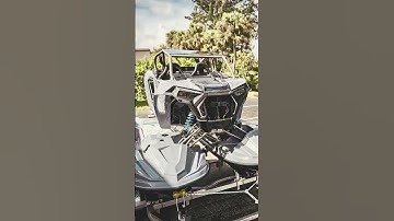 Lots of hand laid carbon composite, a completely custom machined titanium chassis including every